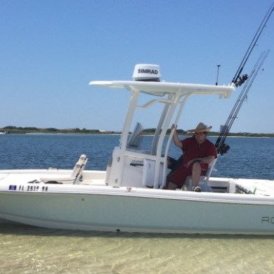 Robalo fishing boat anchored off island in Destin