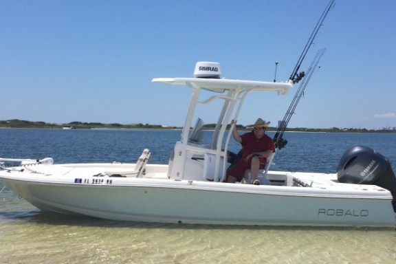 Robalo fishing boat anchored off island in Destin