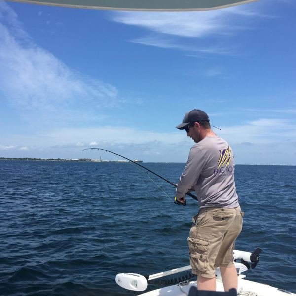 Man fishing off bay boat
