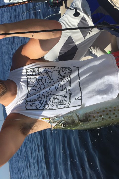 Man holding up speckled trout he just caught