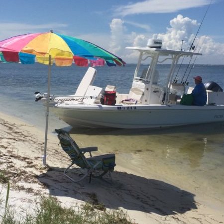 Boat breached on shore at beach