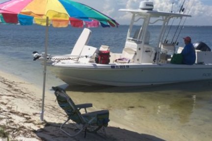 Boat breached on shore at beach